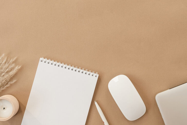 brown desktop with white paper