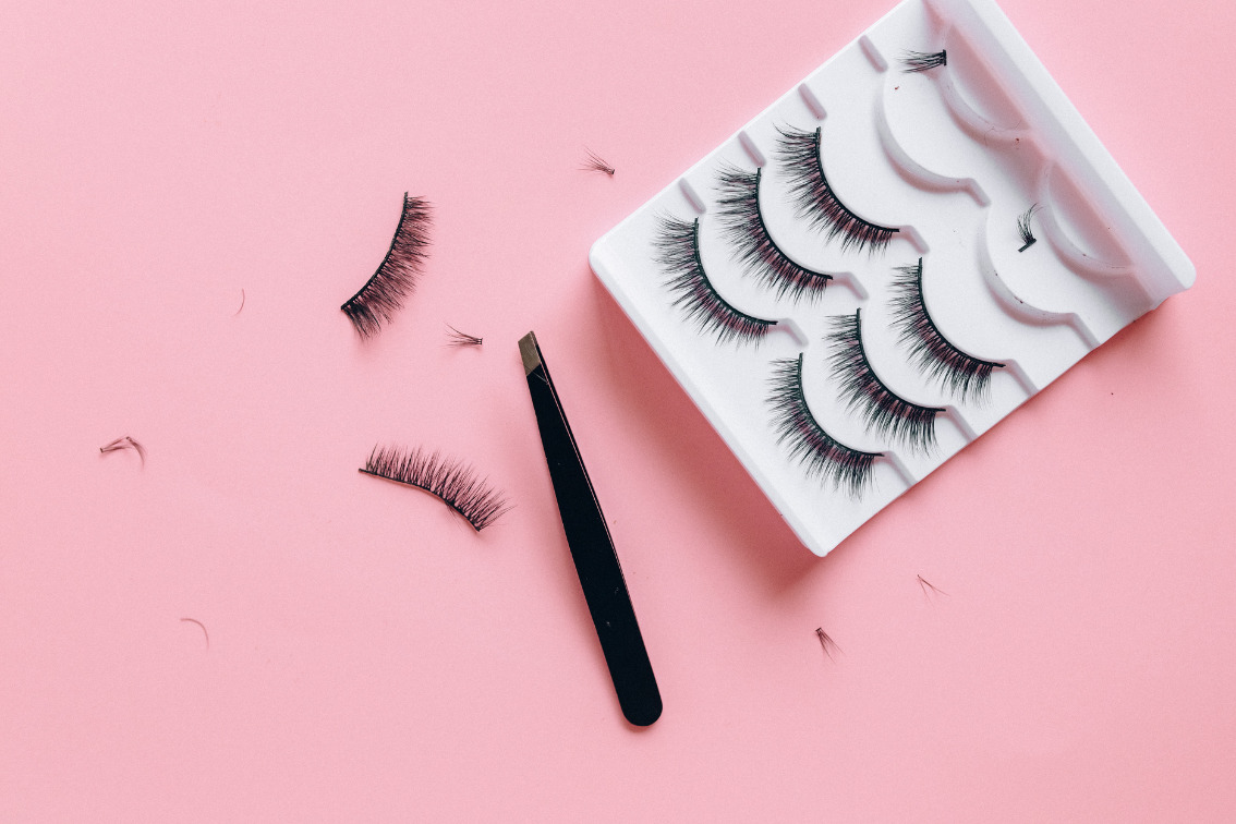 false eyelashes on a pink background