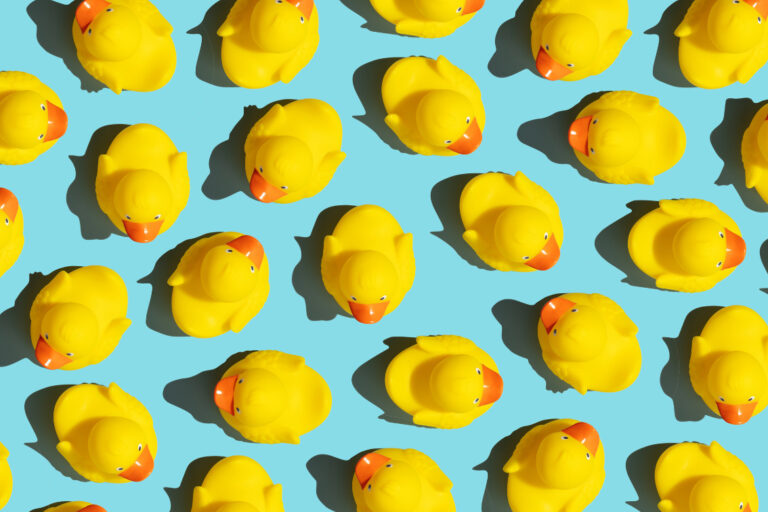 yellow ducks on blue background